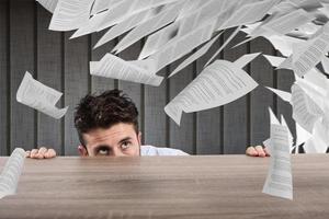 Businessman afraid under the desk. concept of overwork photo