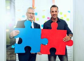 Partnership of business people. Concept of integration and startup with colored puzzle pieces photo