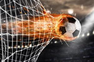 fútbol bola de fuego puntuaciones un objetivo en el red foto