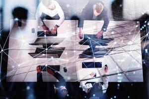 Businessperson in office with network effect. concept of partnership and teamwork. double exposure photo