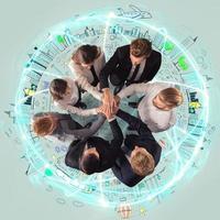 Handshaking business person above a round and ccreative drawing. concept of teamwork and partnership. photo