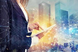 Businesswoman shares document with tablet. Internet network effect on background photo
