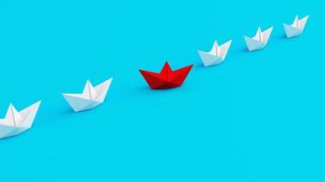 White paperboats in one direction with one red paperboat changing direction on cyan background. Being innovative and creative in life and business. photo