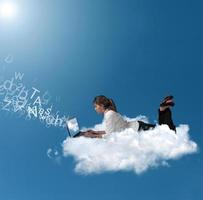 Businesswoman over a cloud photo