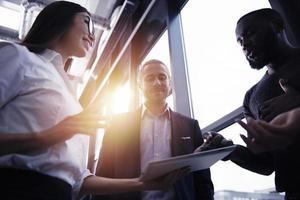 Business people connected on internet network with a tablet. concept of startup company photo