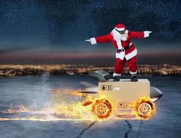 Sants Claus and super fast delivery of package service with box like a rocket. photo
