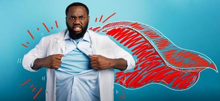 Medic acts like a superhero to fight pandemic of covid19 coronaviruses. Blue background photo