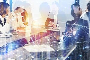 Business people work together in office with internet network effects. Concept of teamwork and partnership. double exposure photo