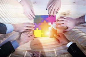 Teamwork of partners. Concept of integration and startup with puzzle pieces. double exposure photo