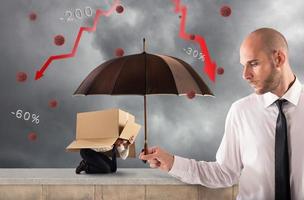 Concept of assistance in your business with a big businessman that holds an umbrella photo