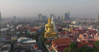 An aerial view of the Giant Buddha and Pagoda at Wat Paknam Phasi Charoen Temple, The most famous tourist attraction in Bangkok, Thailand