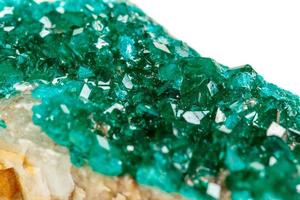 Macro mineral stone Dioptase silicate copper on a white background photo