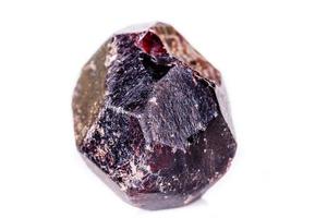 Macro of a mineral garnet stone on a white background photo