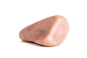 Macro mineral stone Pink quartz on a white background photo