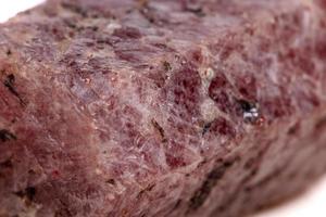 Macro mineral stone Ruby in the breed a white background photo
