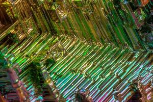 Macro of the mineral bismuth stone on a white background photo