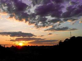 Autumn red sunset with a purple sky photo