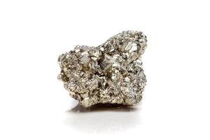 Macro mineral stone Pyrite gold on white background photo