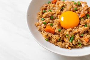 salmon fried rice with pickled egg on top photo