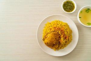 Chicken Biryani or Curried rice and chicken - Thai-Muslim version of Indian biryani, with fragrant yellow rice and chicken photo