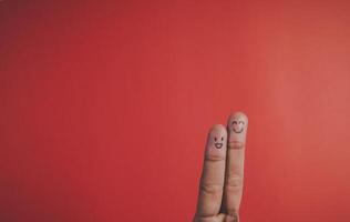 Red background and fingers and cute smile art concept photo