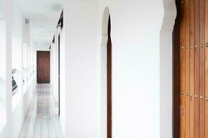 Architecture corridor , interior classic white hotel ,walk way buildings at destination photo