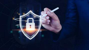 Computer network protection, secure and safe your data concept, businessman holding shield protection icon, Security shield Lock Security Businessman Protect Concept photo
