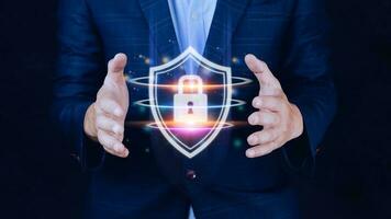 Computer network protection, secure and safe your data concept, businessman holding shield protection icon, Security shield Lock Security Businessman Protect Concept photo