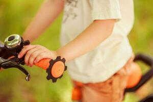 Boy with a bicycle on the street photo