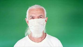 Old Man is Wearing Mask for Protection from Viruses photo