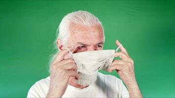 Old Man is Wearing Mask for Protection from Viruses photo