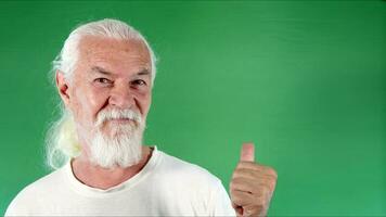 Old Man Makes Okay Gestures with His Finger photo