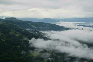 View of the Land above the Clouds village above the Clouds Lolai Hills Village and traditional village covered by clouds in the morning before sunrise photo