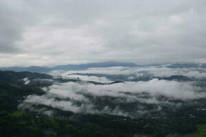 View of the Land above the Clouds village above the Clouds Lolai Hills Village and traditional village covered by clouds in the morning before sunrise photo