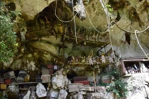 Coffins and graves were placed in rock cliffs. This method is a tradition used as a grave for people who died in the Tana Toraja tribe, Sulawesi photo