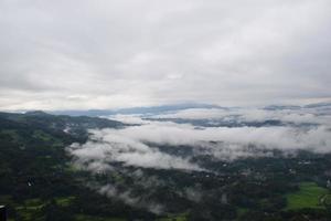 View of the Land above the Clouds village above the Clouds Lolai Hills Village and traditional village covered by clouds in the morning before sunrise photo