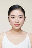 Pretty young female model with fresh healthy glowing skin, modern make up photo