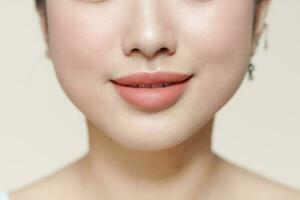 Closeup of Beautiful Young Woman Healthy Lips photo