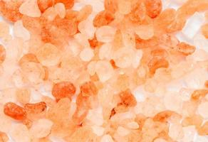 Top view of Himalayan Rock pink Salt isolated on white background photo