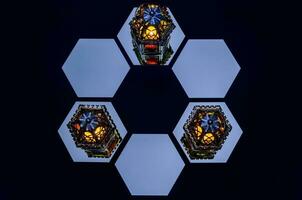Lanterns put on mirror with dark background for the Muslim feast of the holy month of Ramadan Kareem. photo