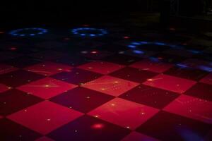 Floor in cage. Floor for dancing. Color music in hall. Bar interior. photo