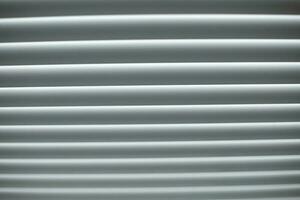 Blinds are white. Window in afternoon. Protection from light. photo