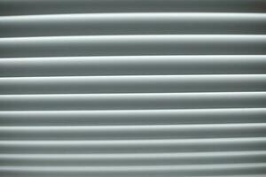 Blinds are white. Window in afternoon. Protection from light. photo