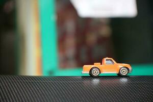 photo with a toy car concept with a blurry background and lots of empty space.