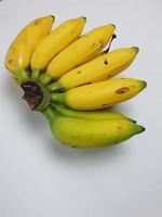 Ripe bananas are yellow on a white background photo