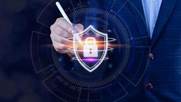 Computer network protection, secure and safe your data concept, businessman holding shield protection icon, Security shield Lock Security Businessman Protect Concept photo
