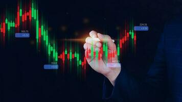 Hand of businessman or trader is touching growing virtual hologram stock, planning and strategy, Stock market, Business growth, progress or success concept. invest in trading. photo