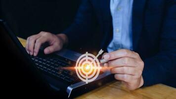 Businessman touching virtual dartboard with arrow ,Business Achievement objective target concept.for setup business objective target concept. photo