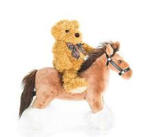 Teddy bear riding a horse photo