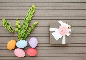 Easter eggs in the basket and gift box photo